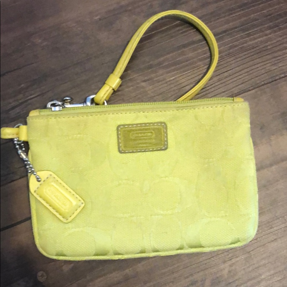 Neon yellow coach wristlet